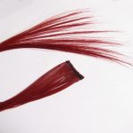 Clip of red hair to wear in natural hair for a more daring look.