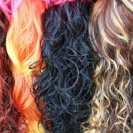 Background texture with stacks of colored wavy hair
